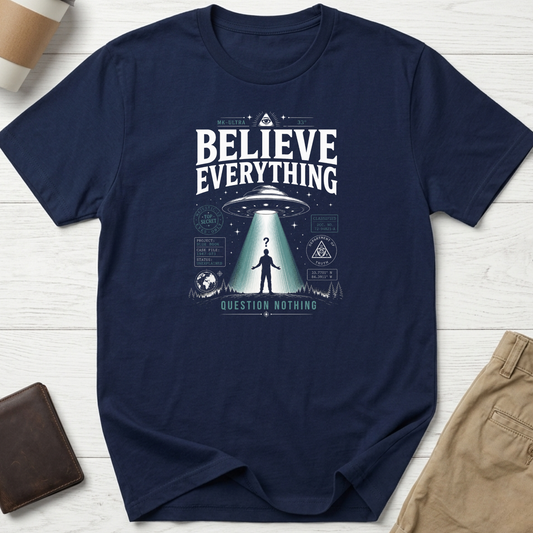 Believe Everything Question Nothing graphic t-shirt featuring vintage UFO abduction artwork with conspiracy-inspired design on navy unisex tee.