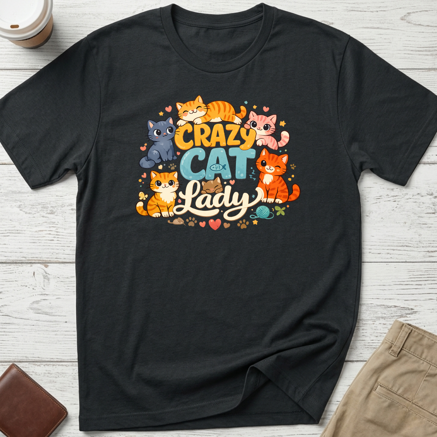 Crazy Cat Lady graphic t-shirt featuring colourful cartoon kittens and playful typography on a black unisex tee.