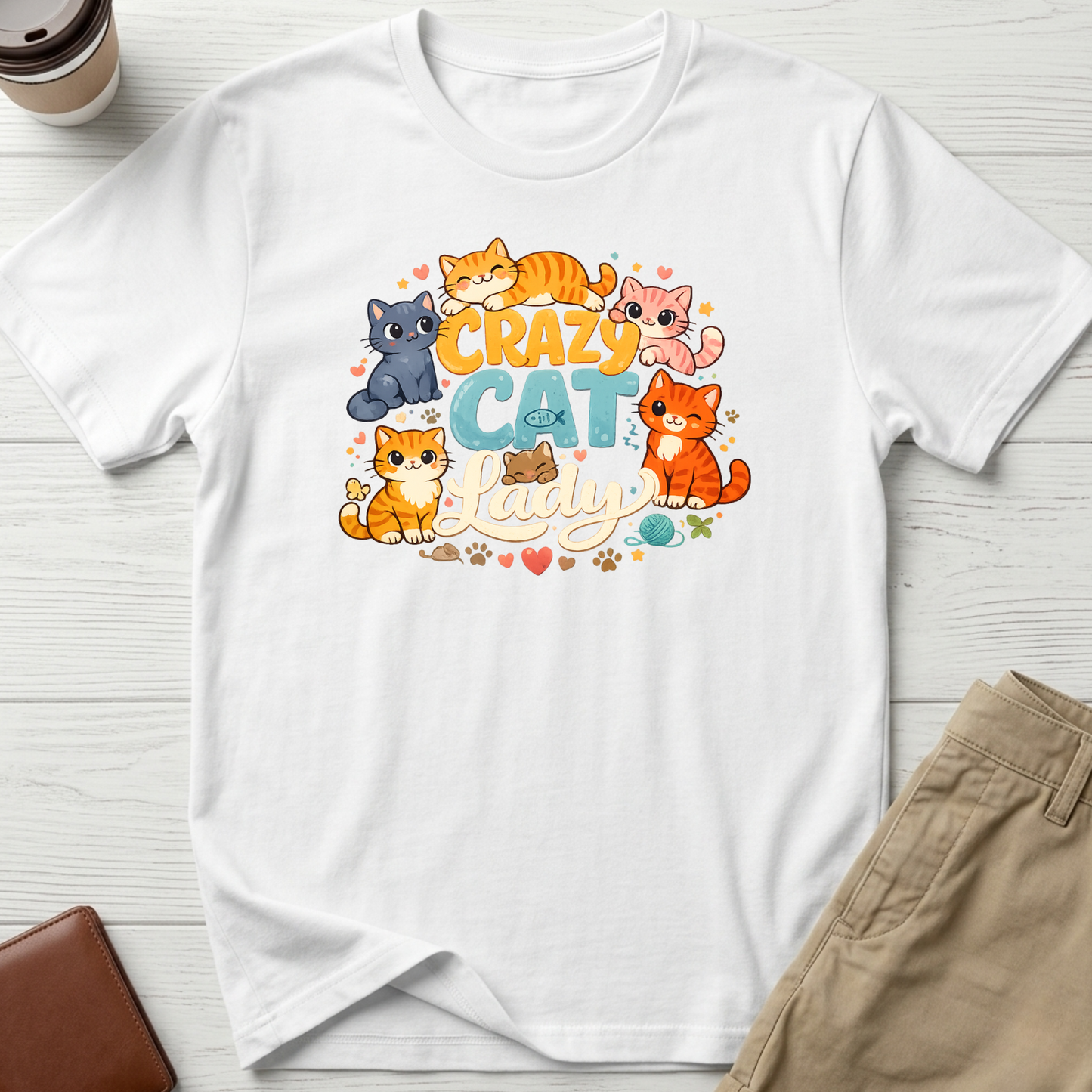 Crazy Cat Lady graphic t-shirt featuring colourful cartoon kittens and playful typography on a white unisex tee.