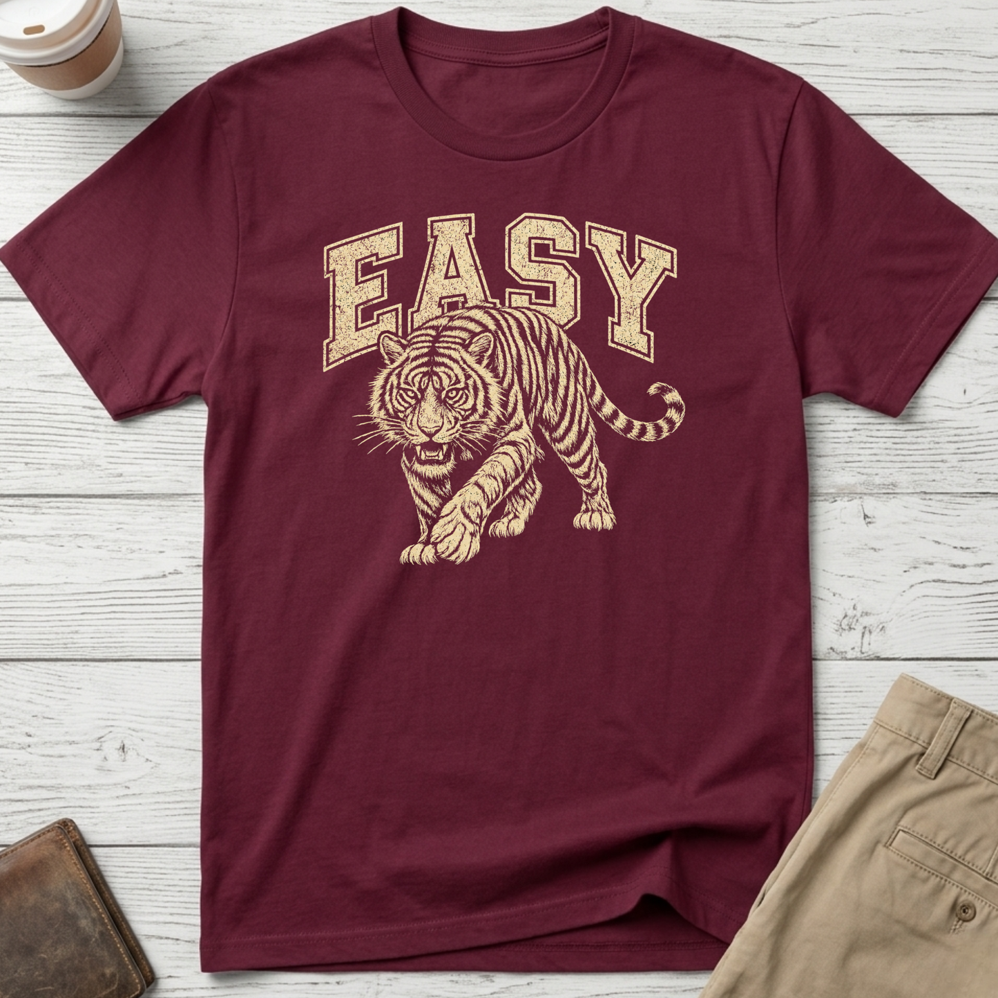Easy Tiger graphic t-shirt featuring a vintage-style prowling tiger illustration with retro collegiate lettering on maroon unisex tee.