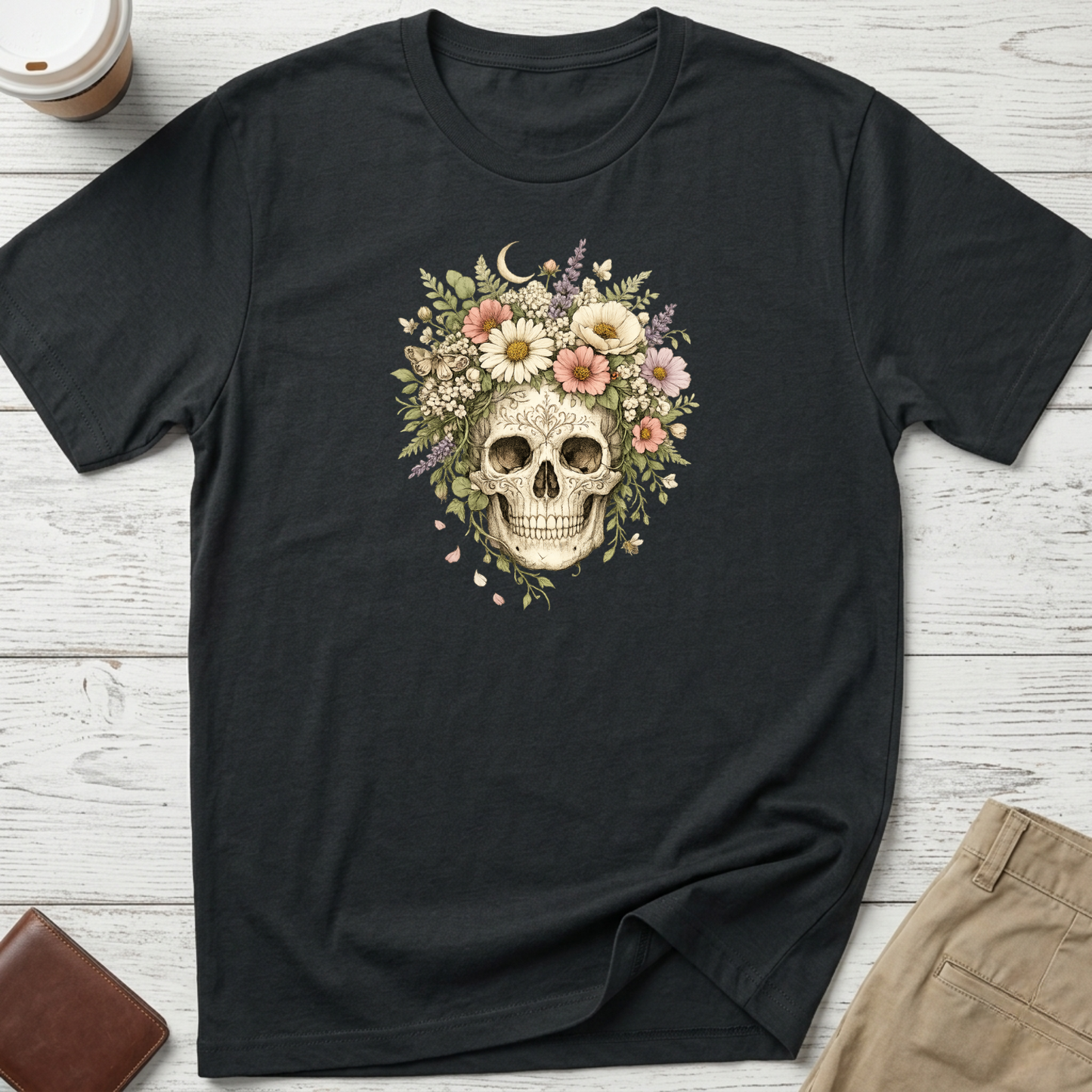 Floral Skull graphic t-shirt featuring a vintage skull surrounded by blooming wildflowers and botanical elements on a black unisex tee.