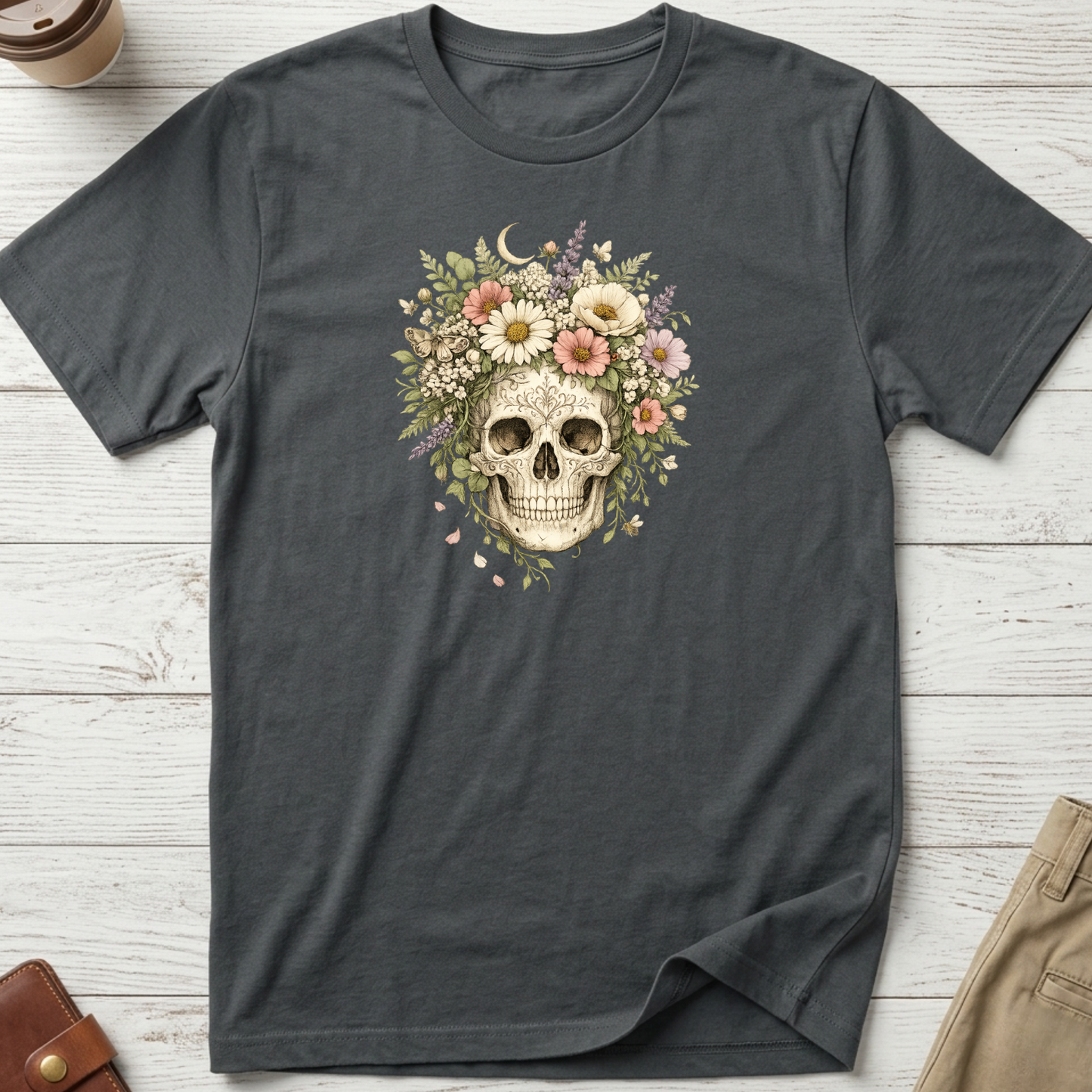 Floral Skull graphic t-shirt featuring a vintage skull surrounded by blooming wildflowers and botanical elements on a charcoal unisex tee.