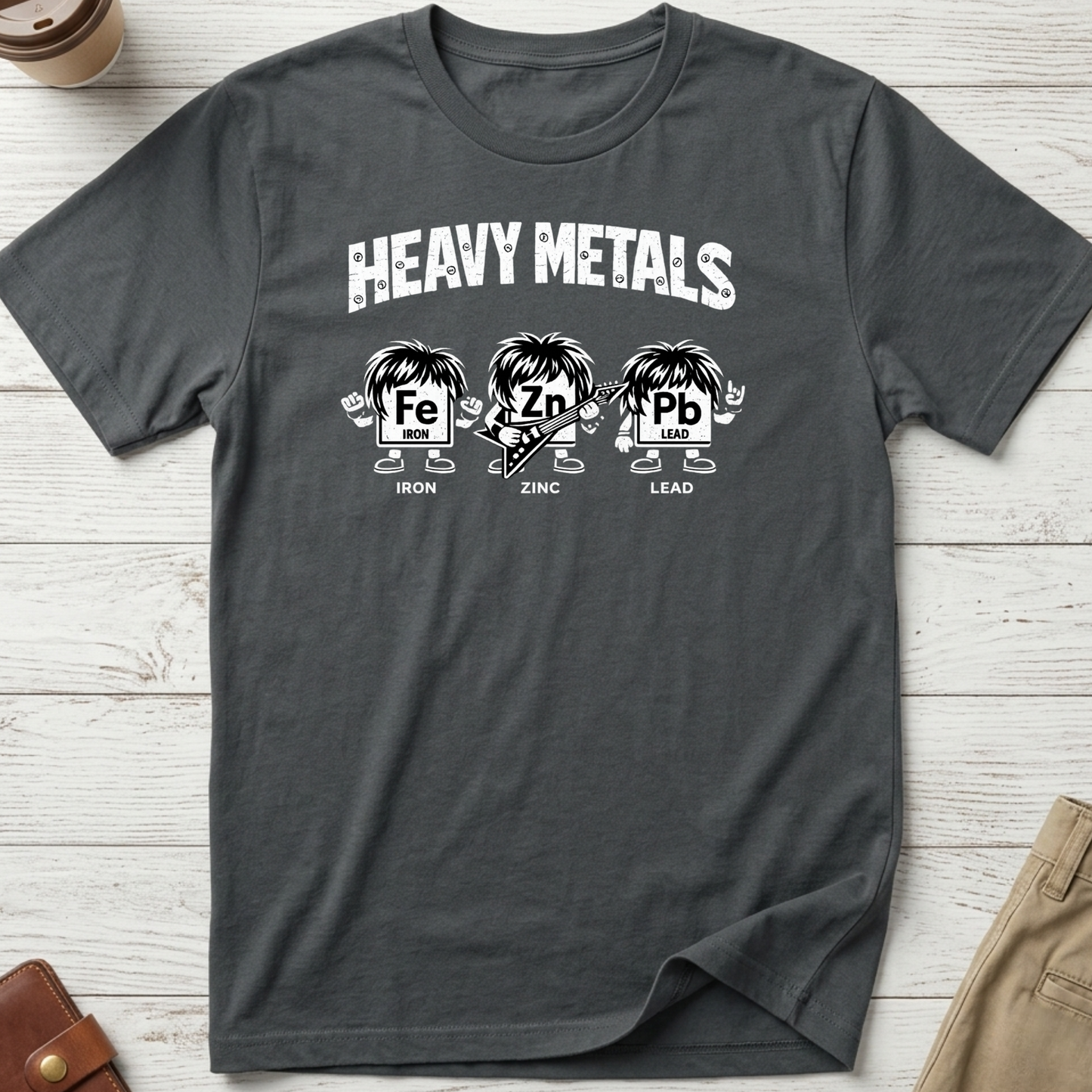 Heavy Metals funny graphic t-shirt featuring Iron, Zinc and Lead characters in a rock band parody design on charcoal unisex tee.