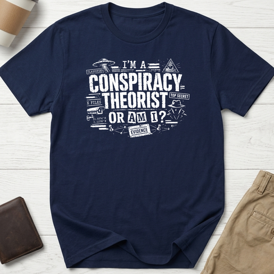 I'm A Conspiracy Theorist Or Am I graphic t-shirt featuring UFOs, classified files, secret agent artwork and distressed typography on a navy unisex tee.