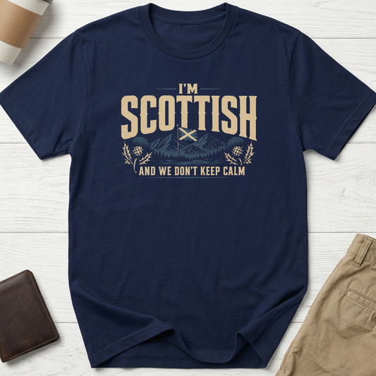 I'm Scottish And We Don't Keep Calm graphic t-shirt featuring the Scottish Saltire, Highland mountains and thistle artwork on a navy unisex tee.