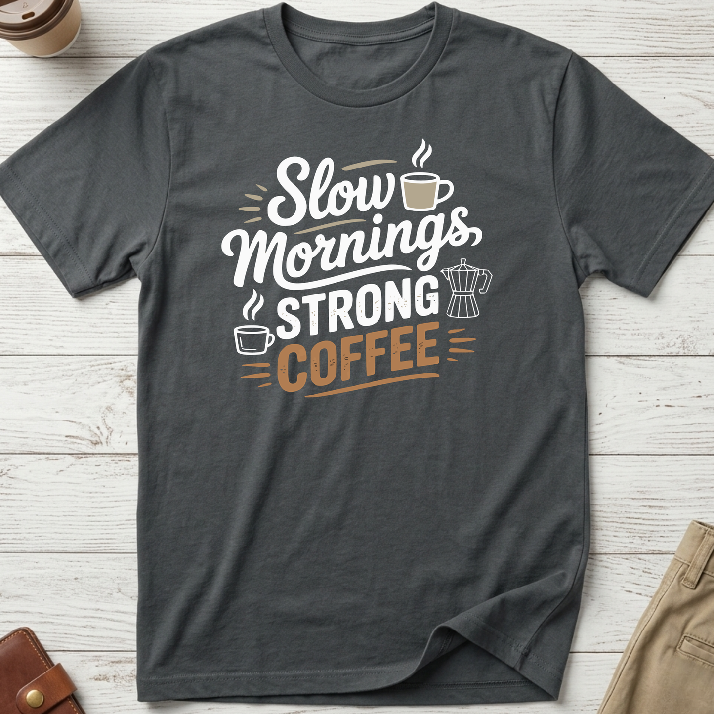Slow Mornings Strong Coffee graphic t-shirt featuring stylish typography with coffee cup and moka pot illustration on charcoal unisex tee.
