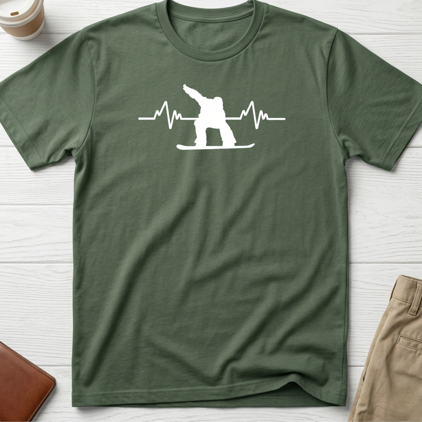 Snowboard Heartbeat graphic t-shirt featuring an ECG heartbeat line with a snowboarder silhouette on a green unisex tee.