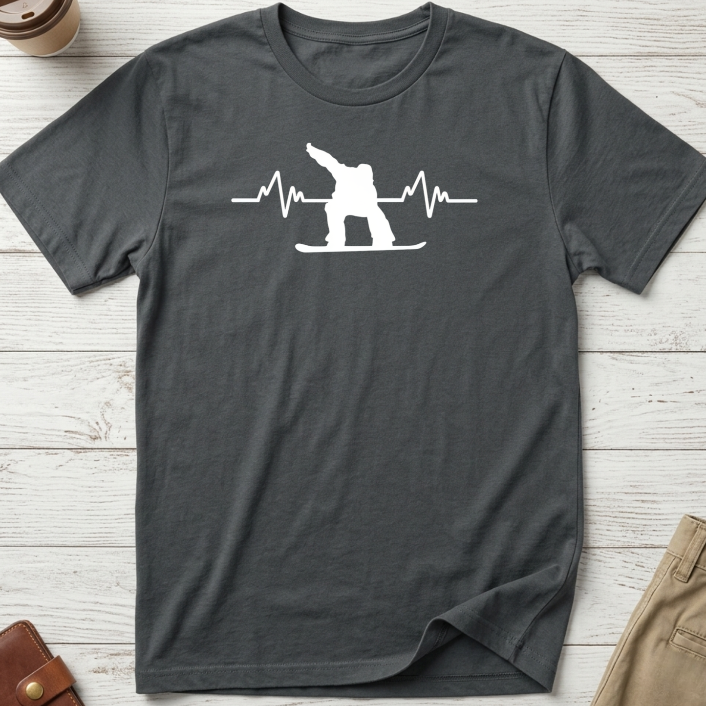 Snowboard Heartbeat graphic t-shirt featuring an ECG heartbeat line with a snowboarder silhouette on a grey unisex tee.