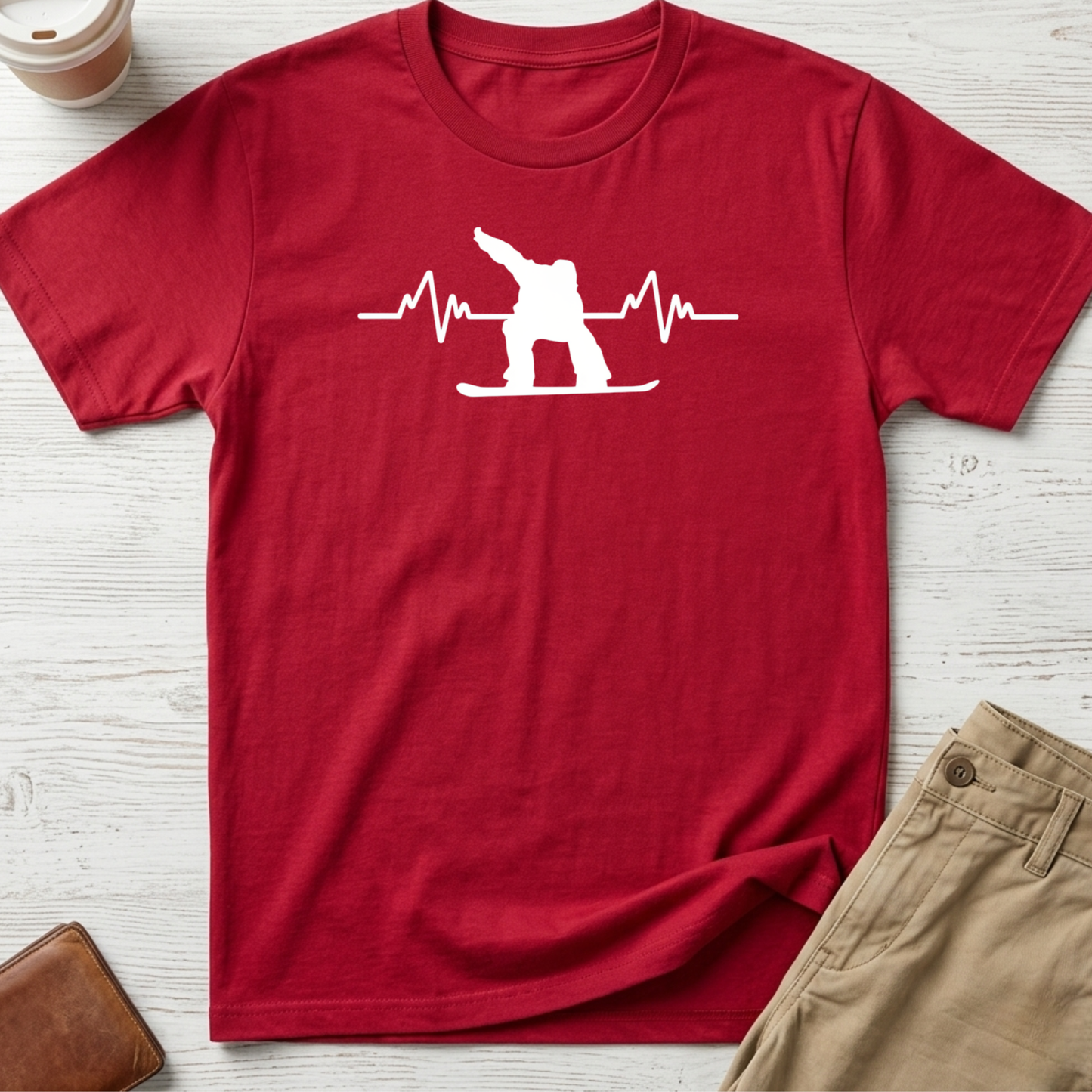 Snowboard Heartbeat graphic t-shirt featuring an ECG heartbeat line with a snowboarder silhouette on a red unisex tee.