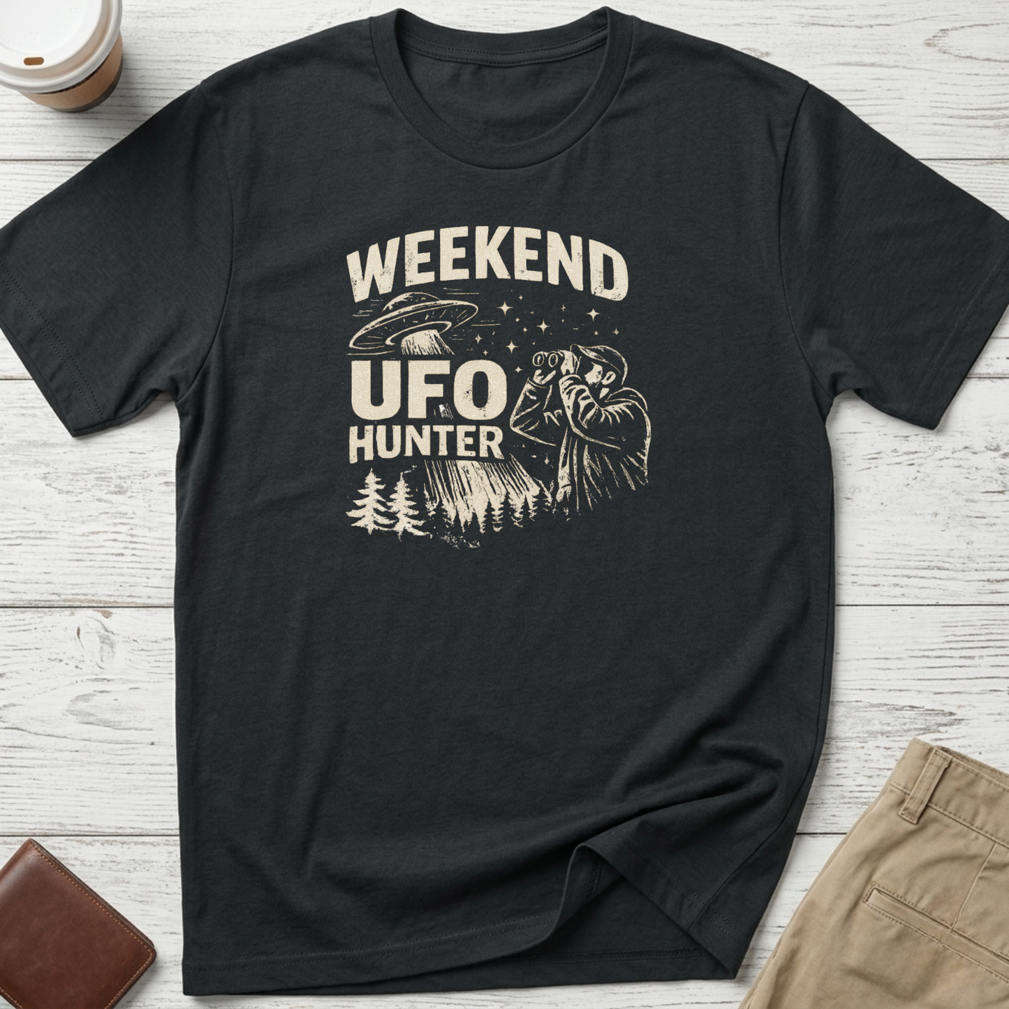 Weekend UFO Hunter funny graphic t-shirt featuring vintage flying saucer artwork and alien hunter illustration on black unisex tee.