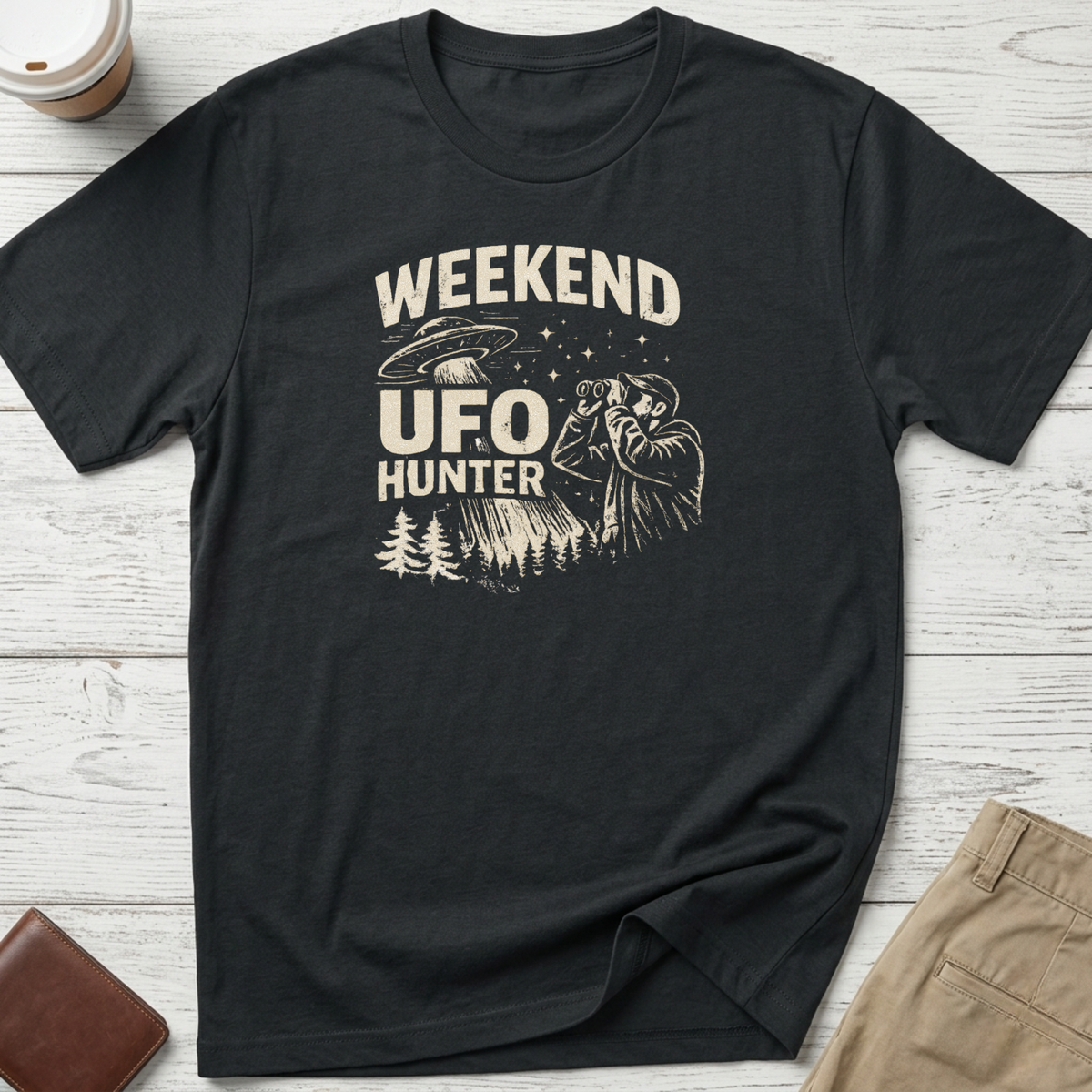Weekend UFO Hunter funny graphic t-shirt featuring vintage flying saucer artwork and alien hunter illustration on black unisex tee.