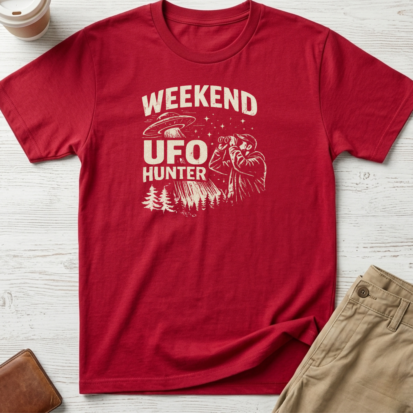 Weekend UFO Hunter funny graphic t-shirt featuring vintage flying saucer artwork and alien hunter illustration on red unisex tee.