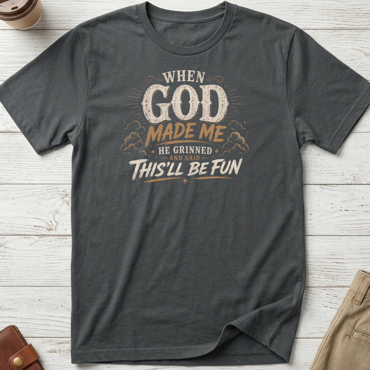 When God Made Me He Grinned And Said This'll Be Fun graphic t-shirt featuring distressed vintage typography on a grey unisex tee.