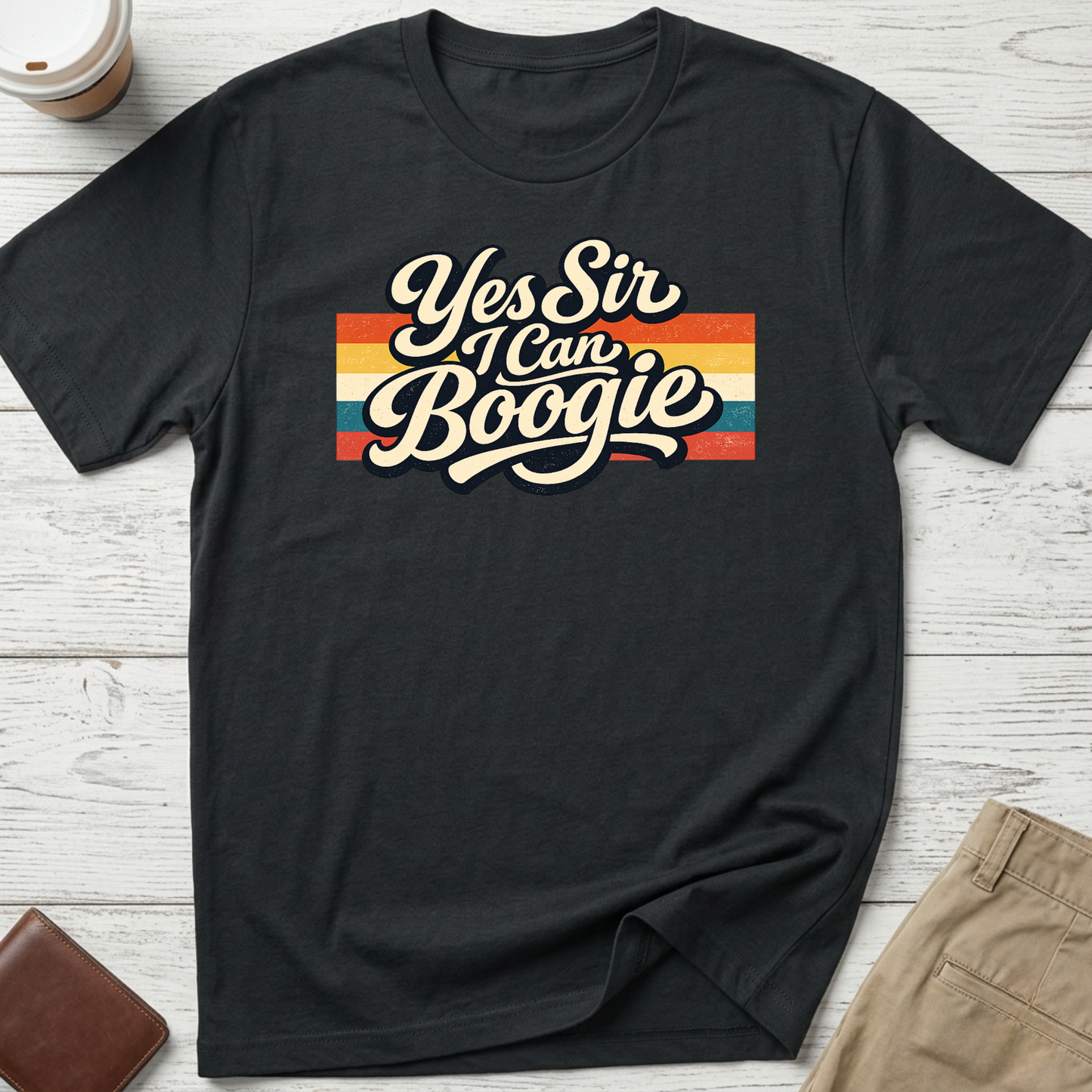 Yes Sir I Can Boogie retro graphic t-shirt featuring vintage typography with colourful 70s-inspired stripes on a black unisex tee.