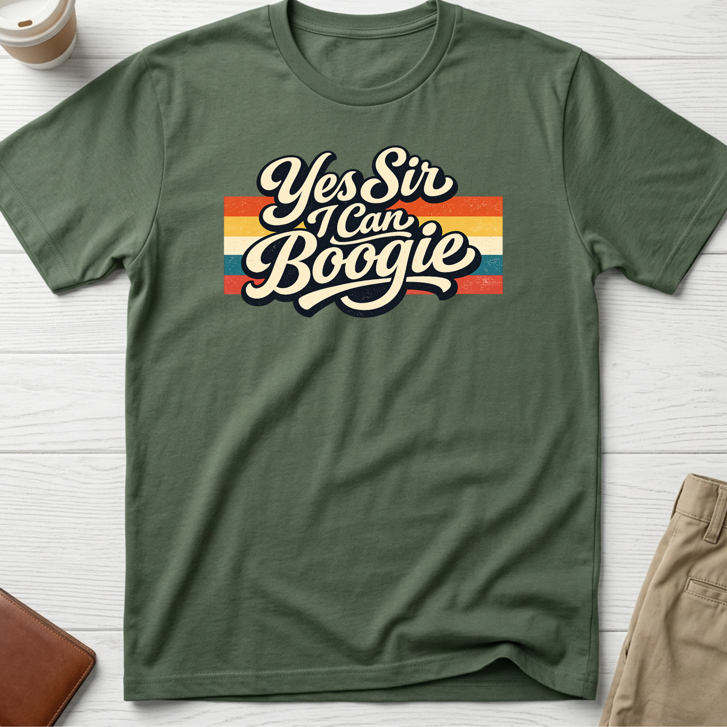 Yes Sir I Can Boogie retro graphic t-shirt featuring vintage typography with colourful 70s-inspired stripes on a green unisex tee.